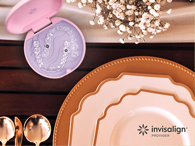 A promotional image featuring a table setting with various plates, bowls, and a toothbrush holder, highlighting dental care products alongside dining ware.