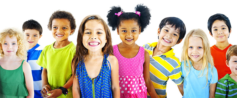 A diverse group of children and adults smiling at the camera.